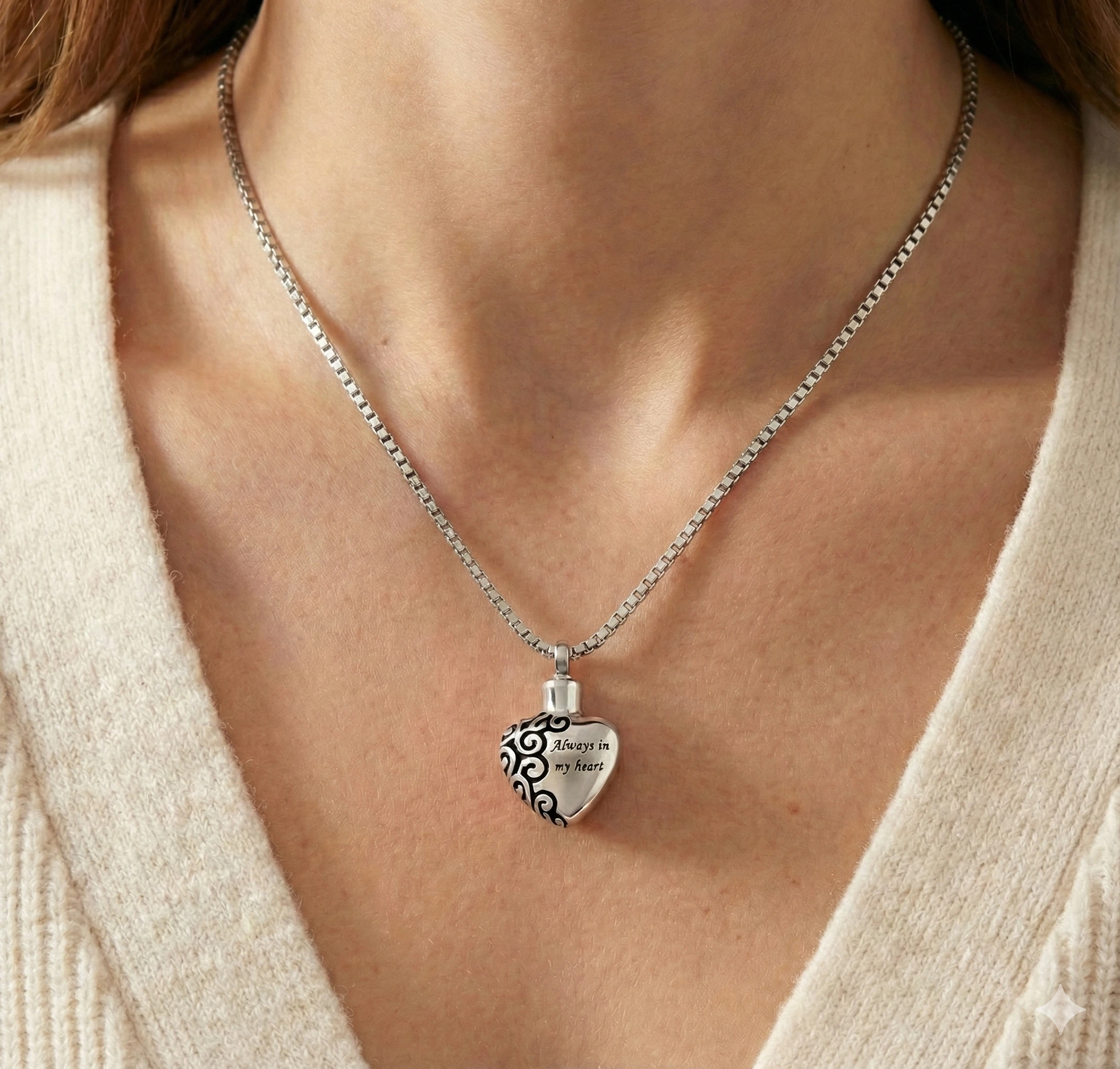 Woman wearing a silver 'Always in my heart' memorial necklace for ashes